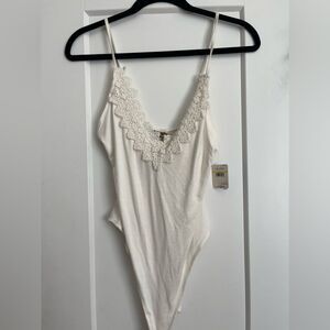 NWT free people body suit- medium